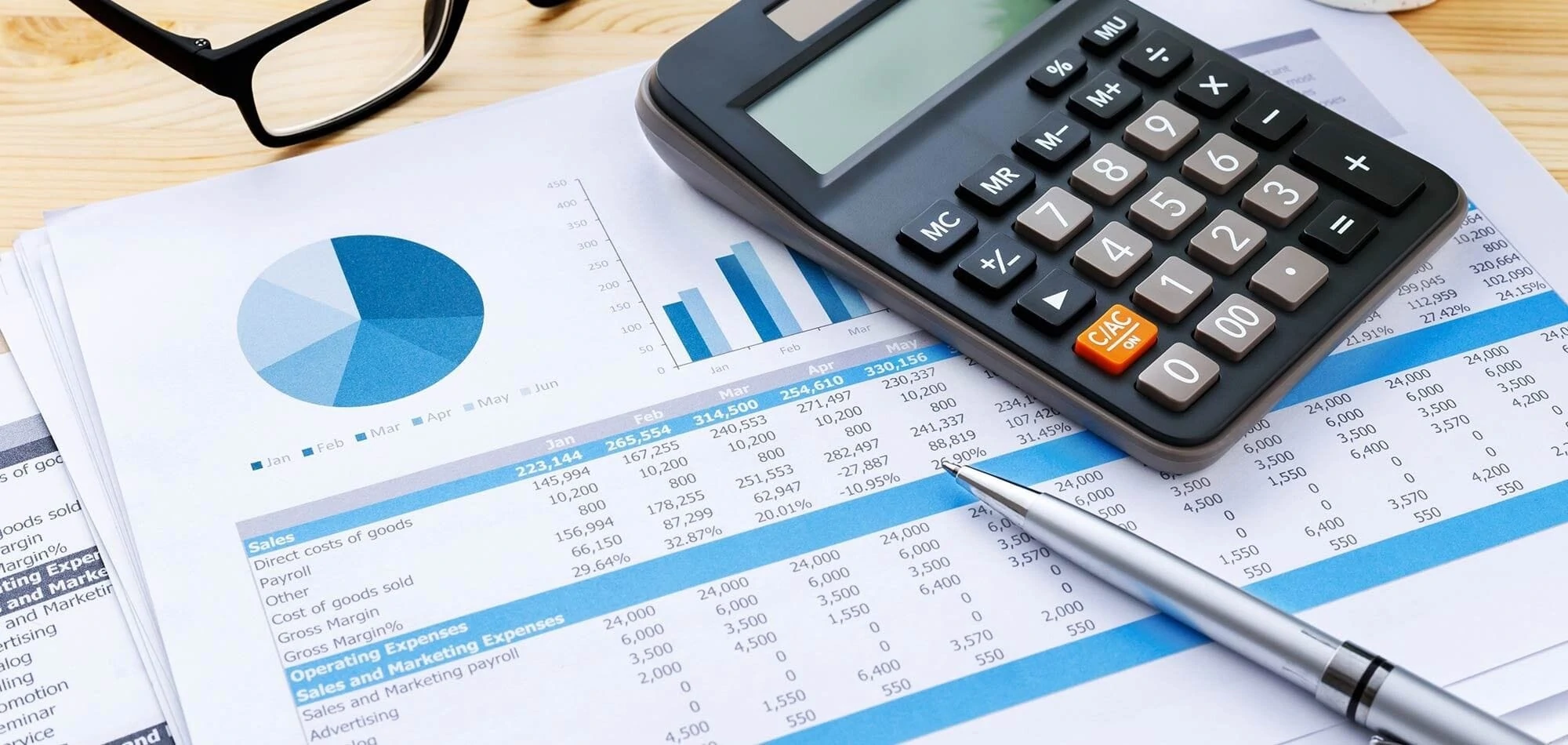A calculator, a pair of glasses, and a pen A calculator, a pair of glasses, and a pen